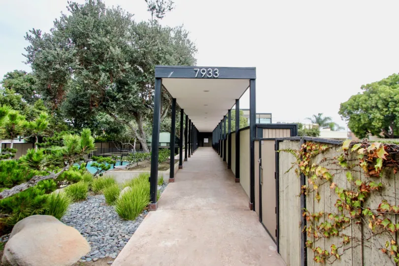 Long walkway with a black & white cover inside Cliffs at La Jolla CA