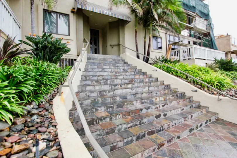 Marble stone steps leading up to a residential building at Coast Pointe in La Jolla California