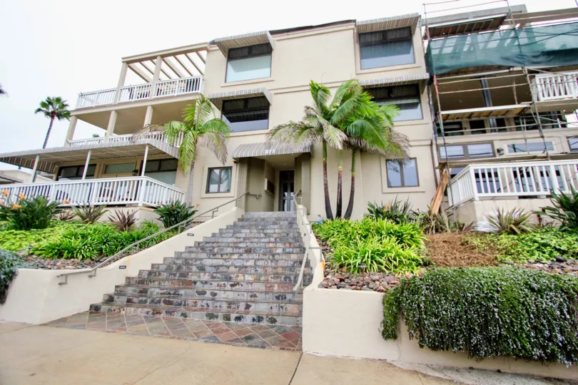 Steps covered in marble tiles leading up to residence at Coast Pointe in La Jolla California