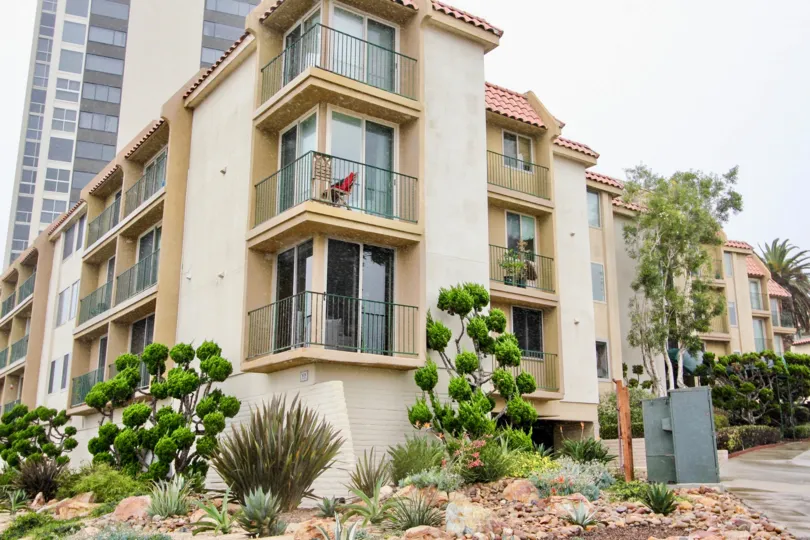Four story residential units with balcony and plants at Coast Regency in La Jolla CA