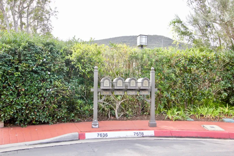 Mail boxes in front of hedges in Coromandel Park in La Jolla CA