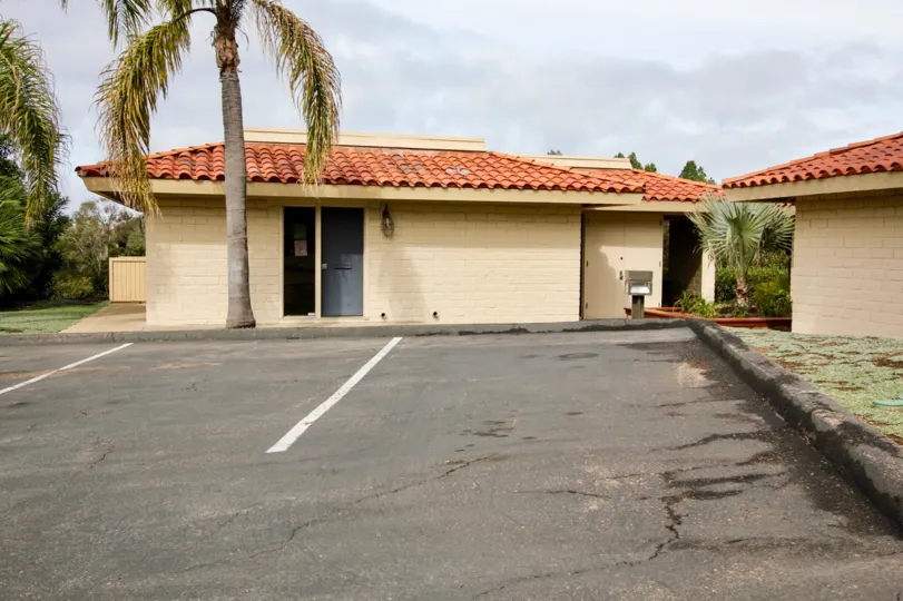 Single story housing near parking spaces inside Coromandel Park in La Jolla CA