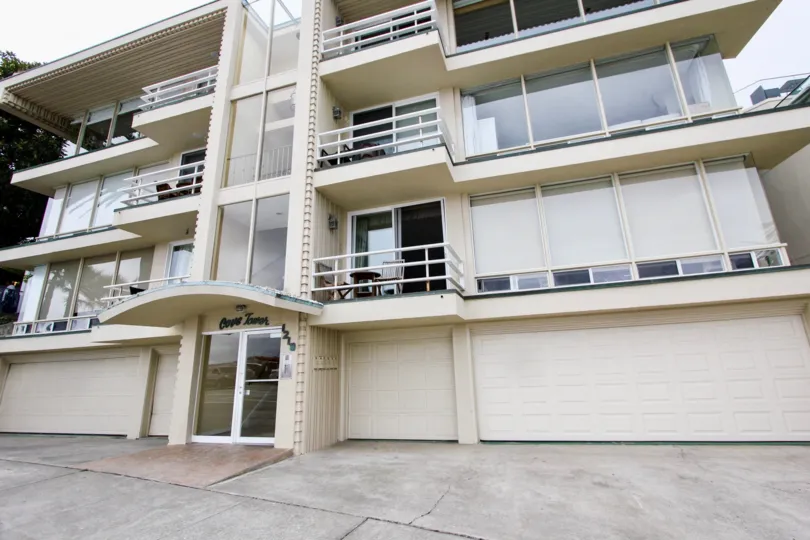 Four story residential units with modern windows at Cove Towers in La Jolla California