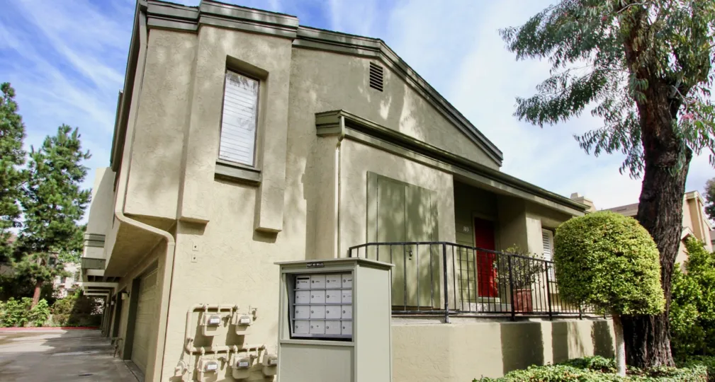 Two story single home with a black railing and plants at Eastbluff in La Jolla CA