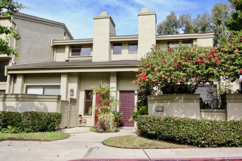 Red and brown doors on residence inside Eastbluff in La Jolla CA