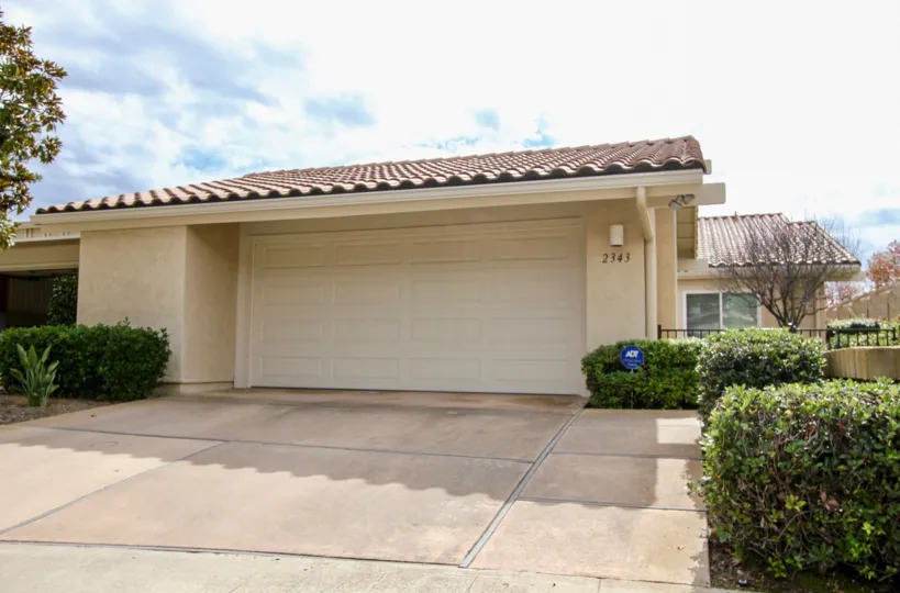 Home with driveway and a garage inside El Dorado in La Jolla CA