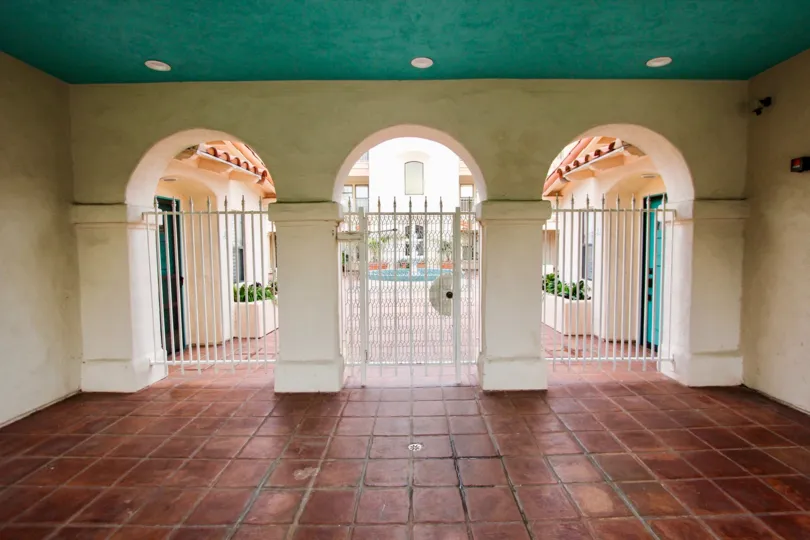 Red tile floor near three arches in La Flor De La Jolla in la Jolla CA