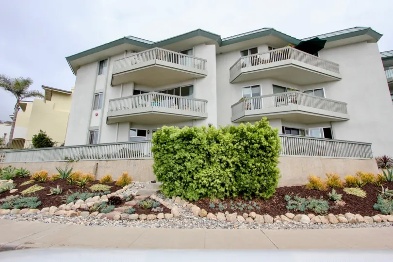 Tall condos with gray railing inside La Jolla Chelsea in La Jolla CA