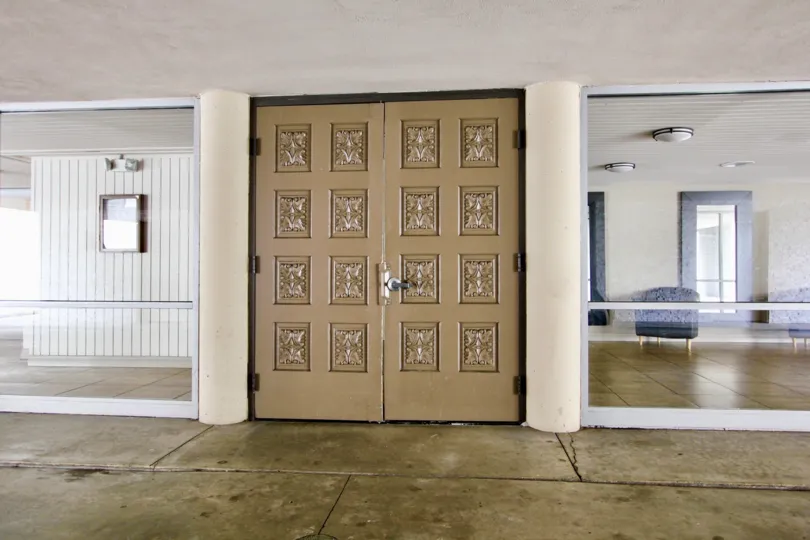 Two large brown doors inside La Jolla Estates in La Jolla CA