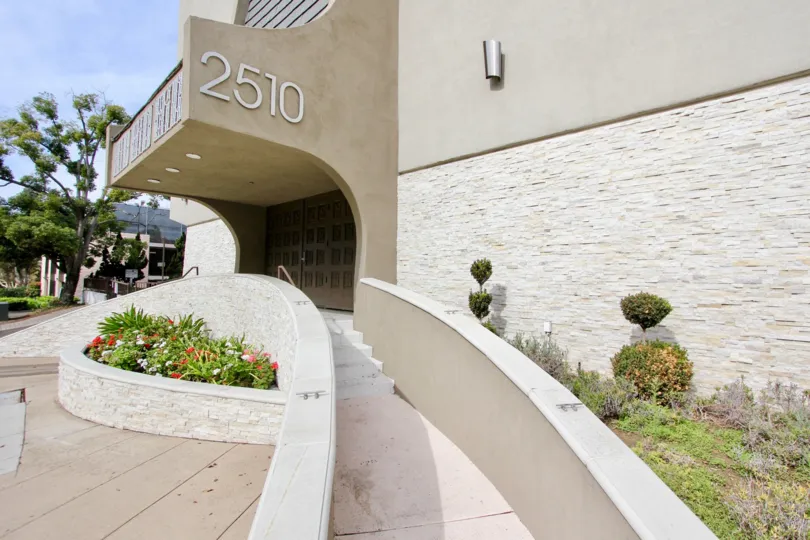 White spiral stairway outside of a community entrance at La Jolla Estates in La Jolla CA