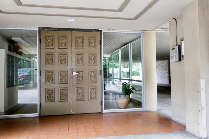 Large brown doors inside of a room in La Jolla Estates in La Jolla CA