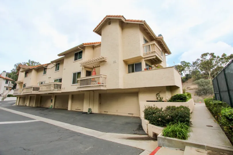 Three story residence with wooden railings inside La Jolla Hideaway in La Jolla CA
