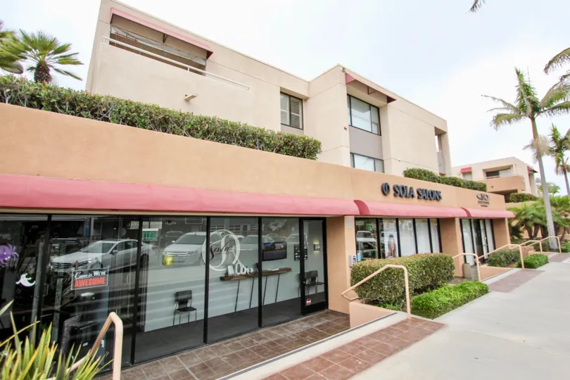 Three story pink condominium units inside La Jolla Promenade in La Jolla CA