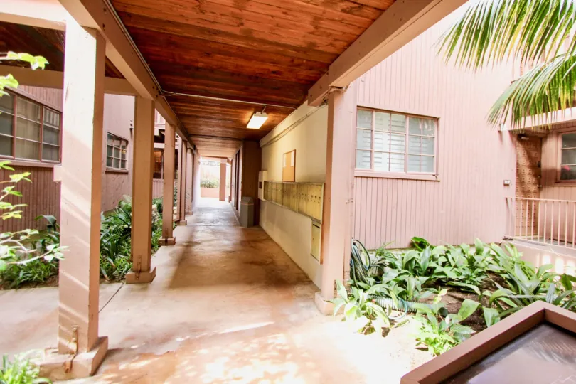 Long pink walkway with a covered walkway in La Jolla Racquet Club in La Jolla CA