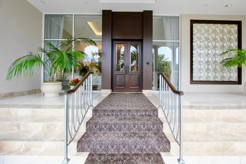 Cement steps with a rug on top of them inside La Jolla Seville in La Jolla CA
