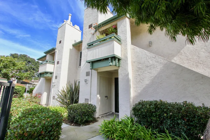 The house in La Jolla Terrace is cover with bushes around the house and has flower pot