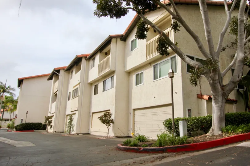 A sunny day in the La Jolla Village Tennis club has many villas and light lamps