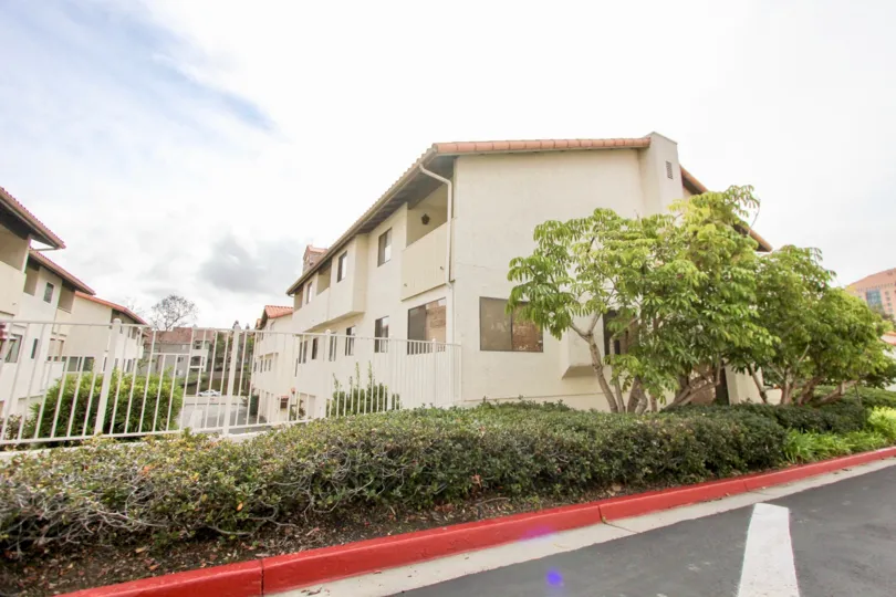 A sunny day at the La Jolla Village Tennis Club, apartments, gate