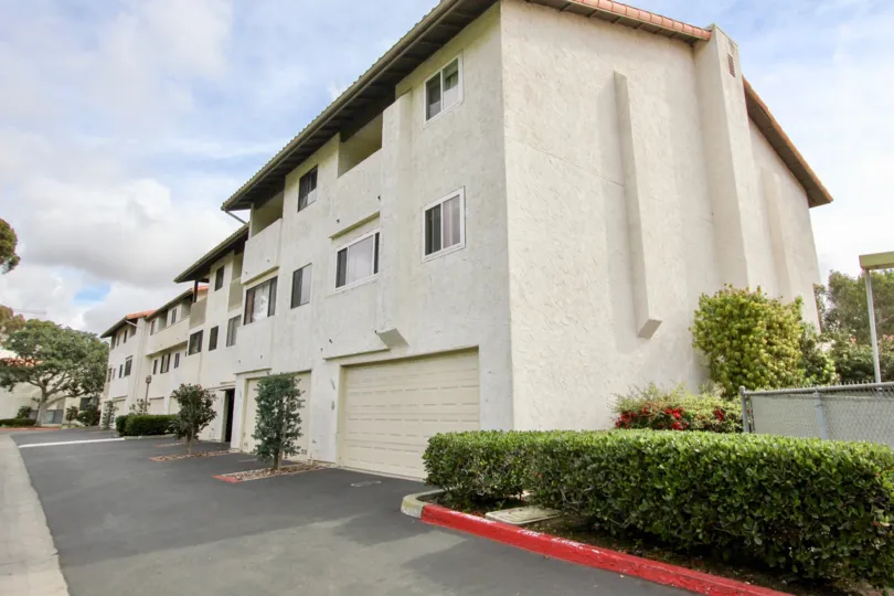 Several properties over garages with a road out front in La Jolla Village Tennis Club