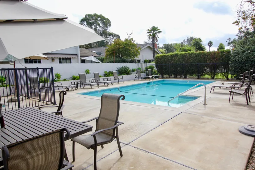 Large swimming pool with gray sets inside the La Jolla Woods in La Jolla CA