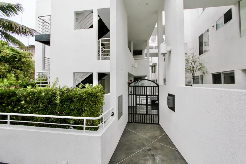 Black gate at white building in Lighthaus in La Jolla CA