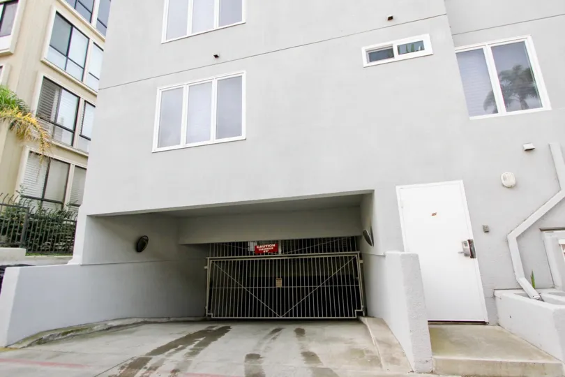 Large metal gate leading to underground parking at the LJ Windigo in La Jolla California