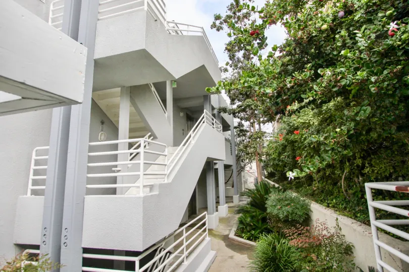 A large stairwell that is white and wide located in LJ Windigo community.