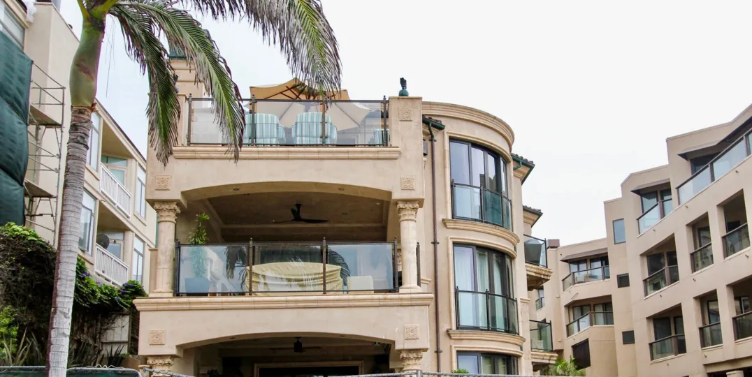 Three story housing with glass walls & windows inside Miramare in La Jolla California