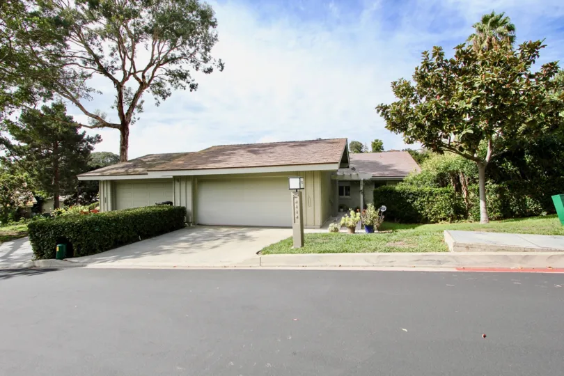 A sunny day in the area of Mount La Jolla area single family home, garage, trees