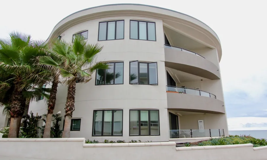 Balconies on all three floors of a residential building at One Neptune.