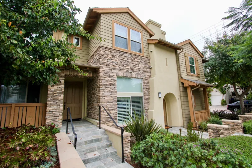 Residence with stone edifice & lots of plants inside Paseo La Jolla in La Jolla CA