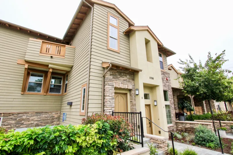Large brown doors on a residence inside Paseo La Jolla in La Jolla CA