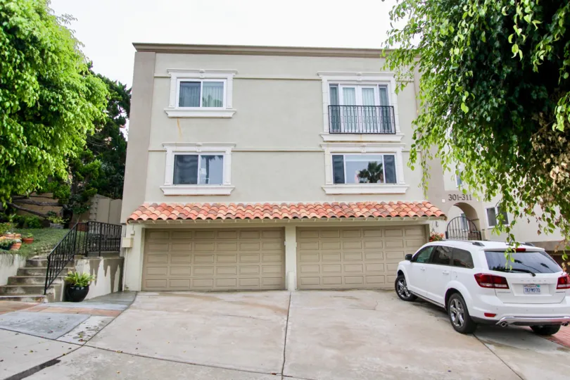A building that consists of two garages that are tan in Prospect Manor community.