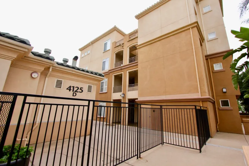 Four story brown building with black gating in Regents La Jolla in La Jolla CA
