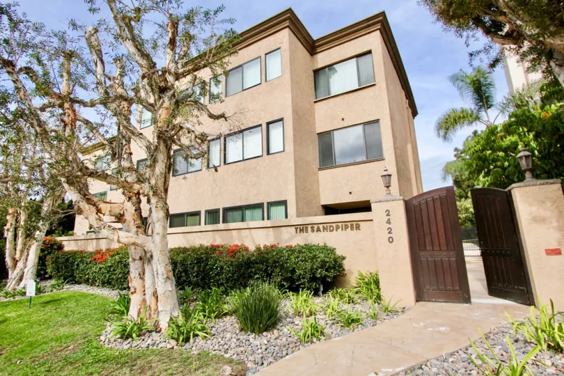 Three story housing behind wall inside Sandpiper in La Jolla CA