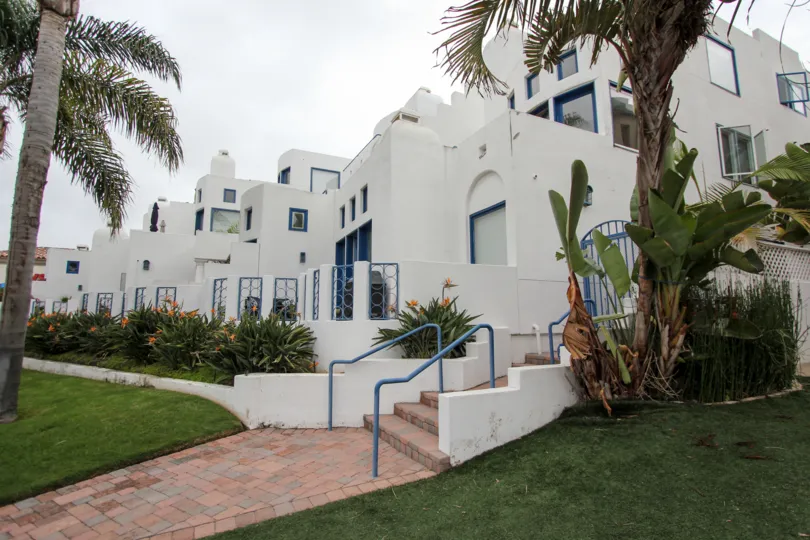 Pink brick stairway leading to white residences inside Santorini West in la JOlla CA