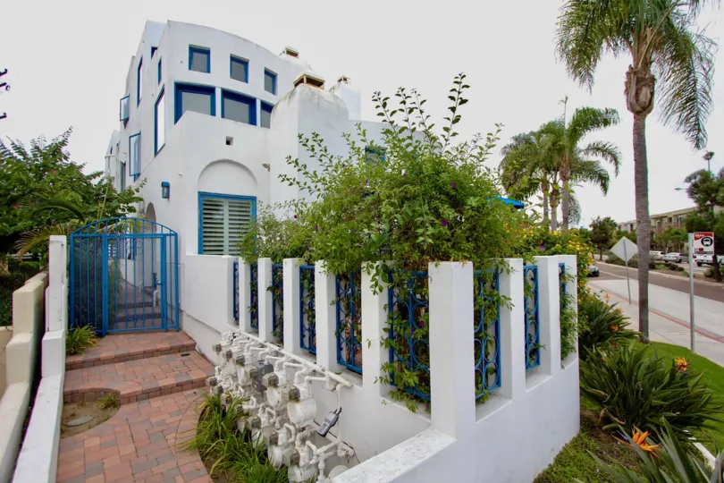 Zoomed path way with small protected garden of Santorini West.