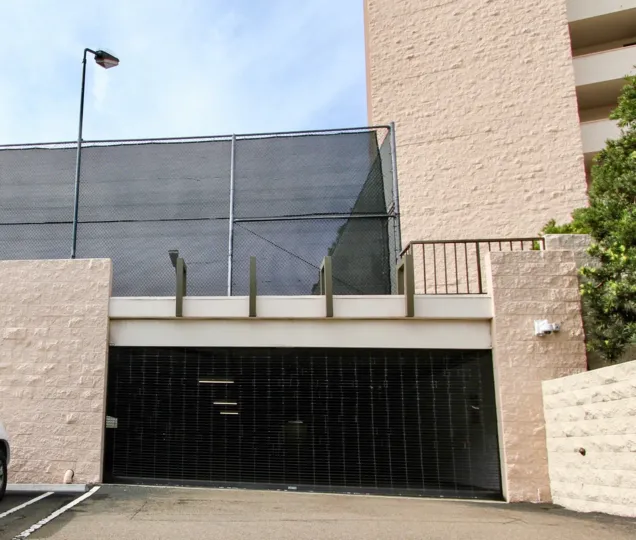 The Shore Tower wide entrance from the front side and plants around