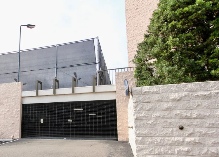Metal gate in front of underground parking inside Shore Tower in La Jolla CA