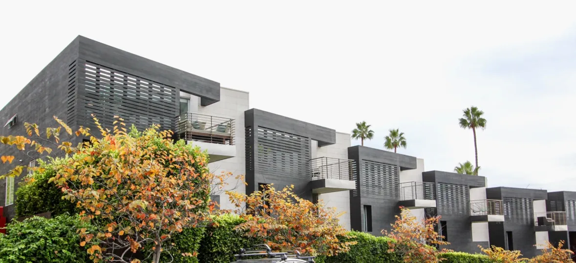 Beautiful landscaping with palm trees and condos in the Six by sebastian Mariscal