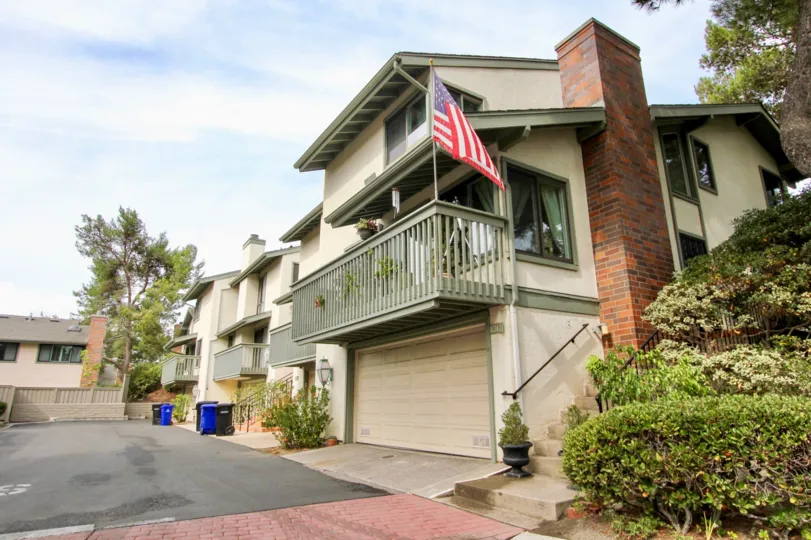 American flag flying from a second story balcony inside Southpointe in La Jolla CA
