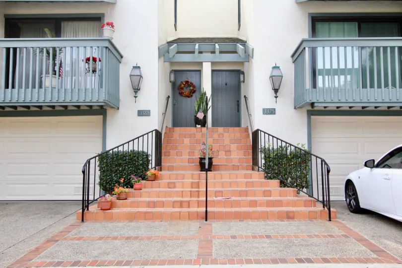 Two blue doors at the end of a stairway in the Southpointe in La Jolla CA