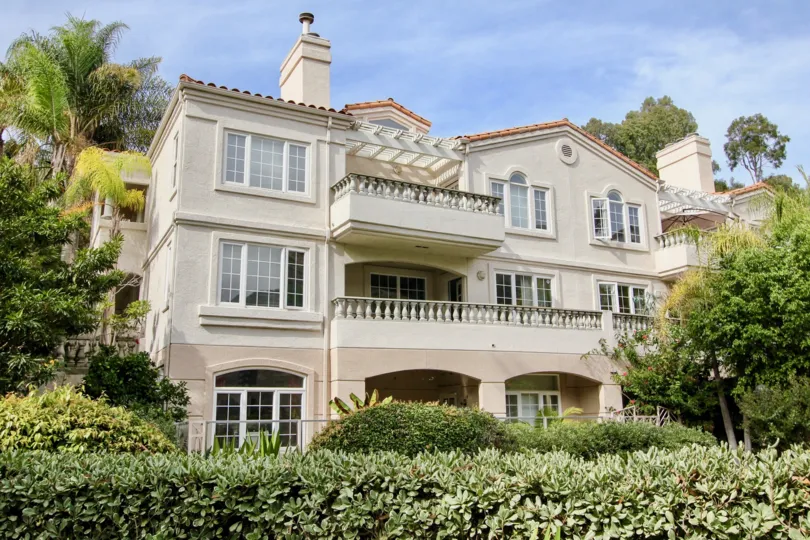 White housing with chimney inside St Tropez in La Jolla CA