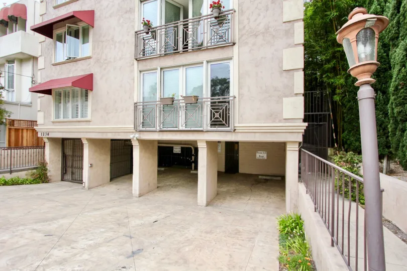 Flower pot is hangered in the balcony of the apartment with glass door and window