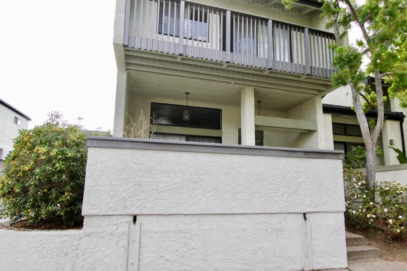 A residaence with a balcony in The Woodland community.