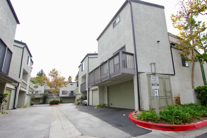 Odd shaped housing units near driveway at The Woodlands in La Jolla CA