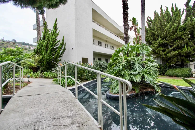 A sunny day in the area of Villa Del Lido, entrance way, trees, water