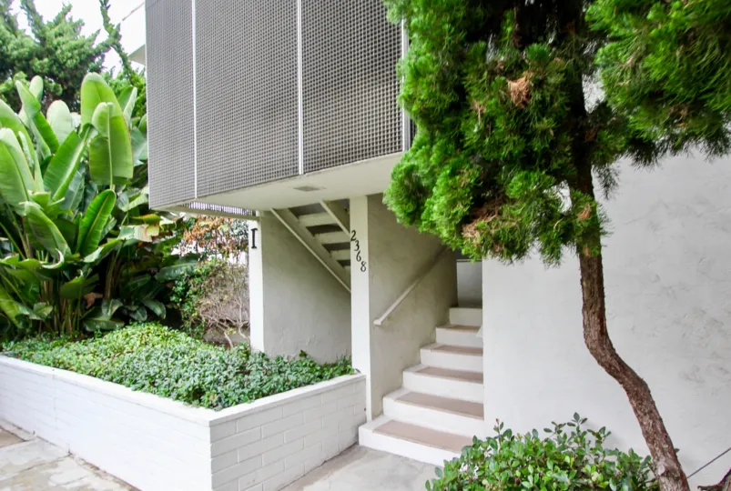 Villa mentioned with 2368 in wall near to the stairs and has bushes and treees