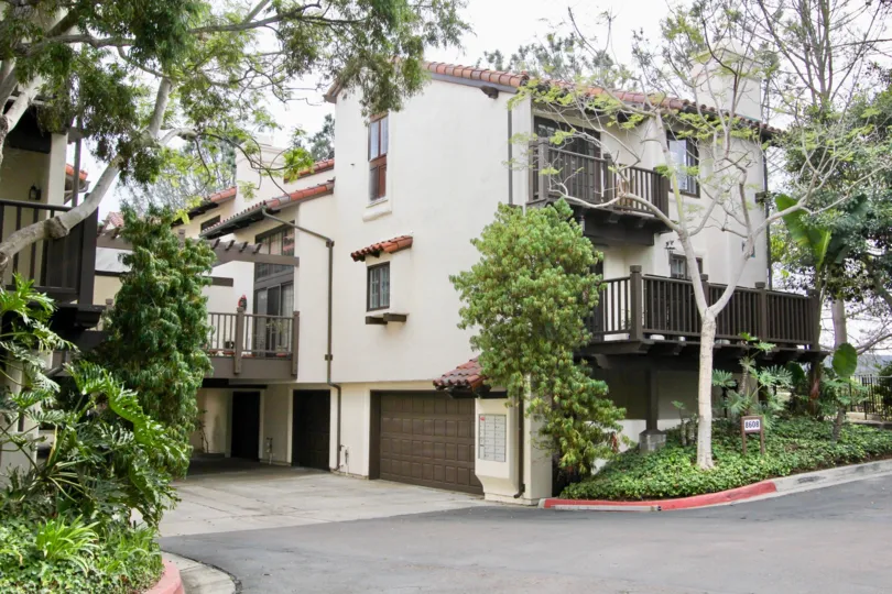 Large brown garage door near mail boxes in Villas Malllorca in La Jolla CA