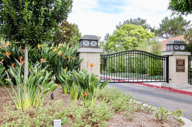 Two huge lights on the sides of a gate at Windemere in La Jolla